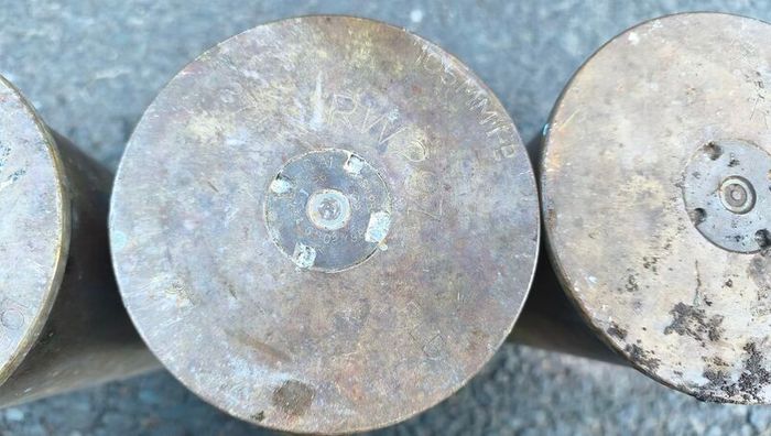 four empty brassartillery shell casings