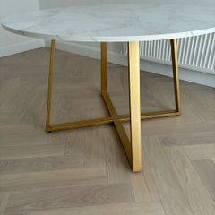 Laura James round dining table