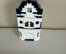 Rituals tealight holder in the shape of very first Rituals store in Amsterdam