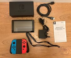 Nintendo Switch + charger+ 6 Games + hard shell case