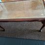 Vintage Queen Anne-style wooden coffee table featuring cabriole legs, a glass top protecting an inset leather surface with gold tooling Image 9