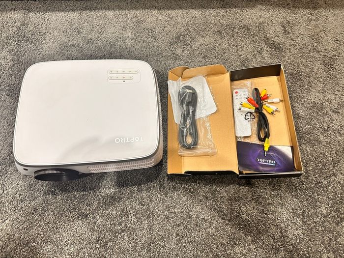 Tiptop Home Projector like ne condition comes with all accessories and a 100" cloth projector screen.