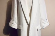 Zara ecru blazer with rolled- up sleeves.