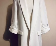 Zara ecru blazer with rolled- up sleeves.