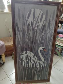 Vintage framed needlepoint tapestry depicting a white swan swimming