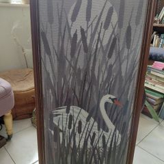 Vintage framed needlepoint tapestry depicting a white swan swimming