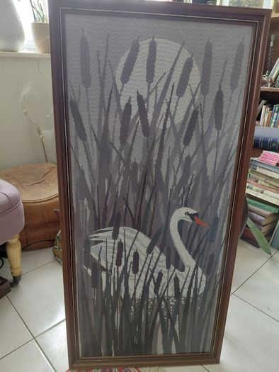 Vintage framed needlepoint tapestry depicting a white swan swimming