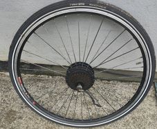 28" electric rear wheel with good tires 36v/350w needs  few spoke to be replaced but works