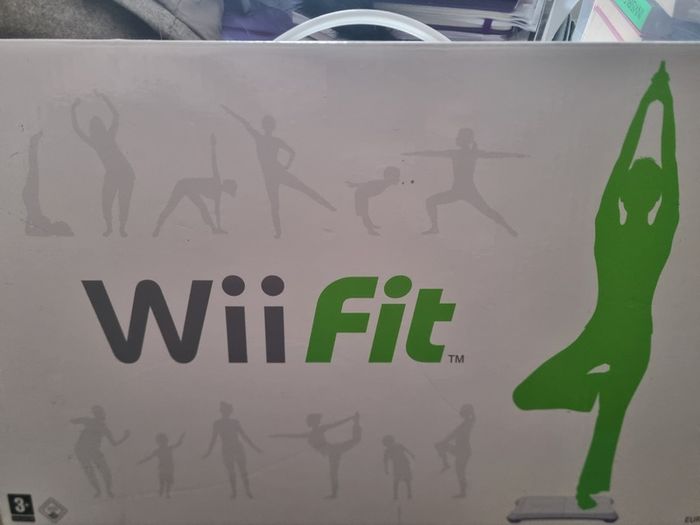 Nintendo Wii console with balance board and 21 games