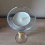 A tall clear glass candle holder Image 2