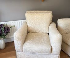 Cream and white floral armchair
