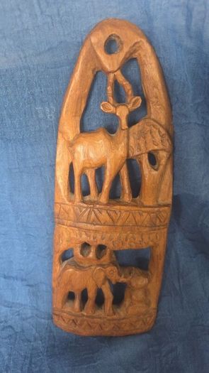 Hand-carved wooden wall hanging