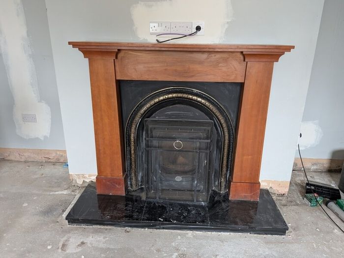 Wooden fireplace with surround