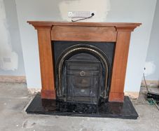 Wooden fireplace with surround