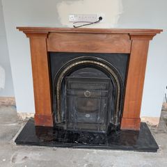 Wooden fireplace with surround