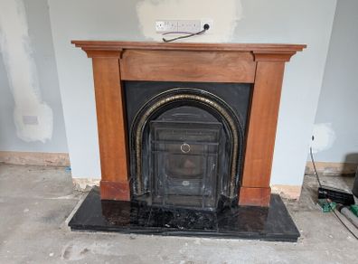 Wooden fireplace with surround