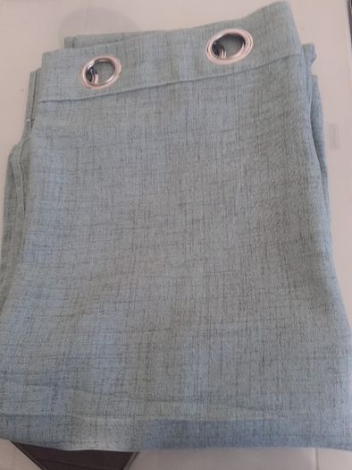 As new green linen curtains .Size 56"width x 82"length .A lot brighter than the pics .Just hung for a few days but dont go in the room .Unlined but heavy .Ringtop 12 euro .