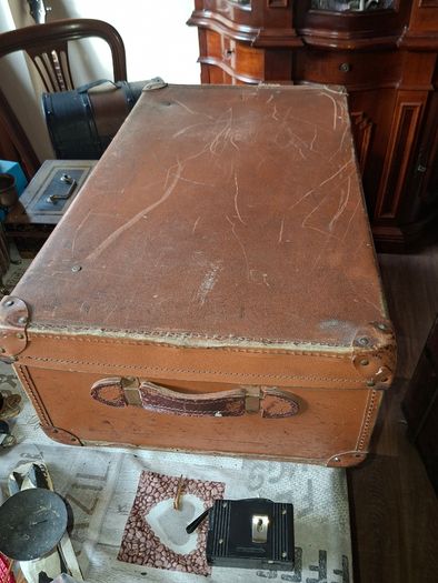 Vintage Hard Travel Suitcase, 1940s to 1950s, featuring a rigid textured brown exterior, metal corner guards, and a molded carry handle, Measurements are in the photo's, Postage Available or Collection