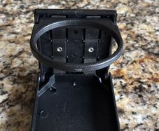 Bolt on foldable cup holder