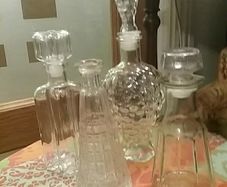 Four Glass Decanters with Stoppers