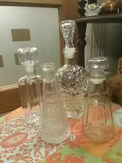 Four Glass Decanters with Stoppers