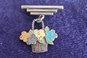 Vintage sterling silver and enamel flower basket brooch.