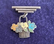 Vintage sterling silver and enamel flower basket brooch.