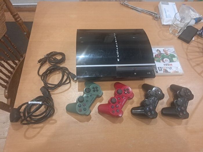 : PS3 Console Bundle (Faulty Disc Drive) + 4 Official Sony Controllers & Cables  Description: Selling a PlayStation 3 bundle for parts, repair, or digital-only use.