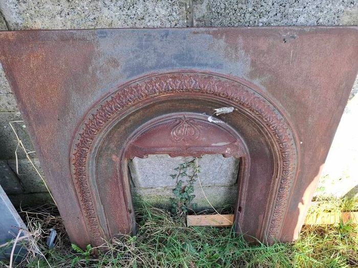 Cast iron fire inset and mahogany fireplace