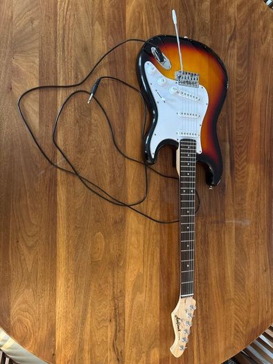 Electric guitar with amplifier