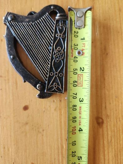 8 Items. 4 X Cast Metal Bottle Openers, A Cast Wallmounted Celtic Cross, 3 Harps For Decorative Purposes.