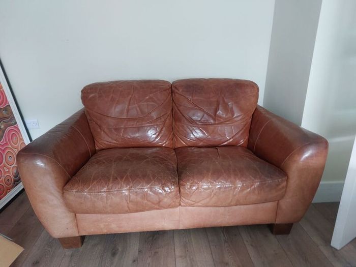 2 seater brown leather sofa. Approx 150cm width, approx 90cm breadth/ from back to front