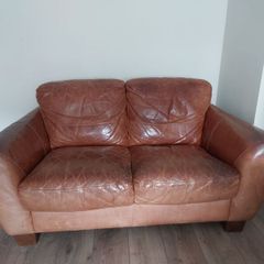 2 seater brown leather sofa. Approx 150cm width, approx 90cm breadth/ from back to front