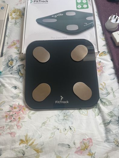 weighing scales FitBit and FitTrack