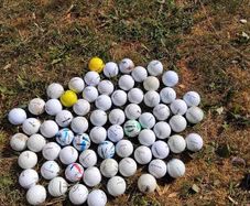 65 assorted golf balls
