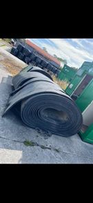 Rolls of rubber & crane skips