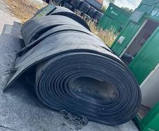 Rolls of rubber & crane skips