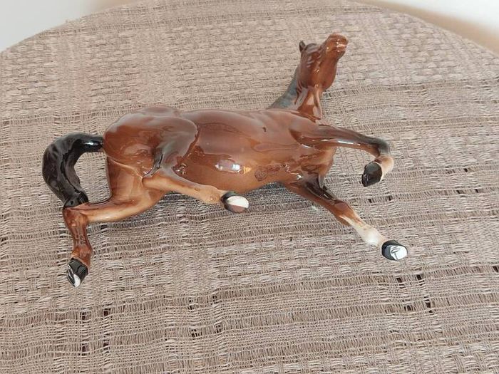 Vintage Royal Doultot porcelain horse. new in the box.