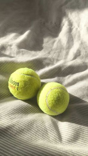 Pair of Tennis Balls (1x Wilson US Open + 1x Unbranded)