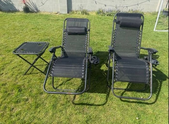 2 black recliner garden chairs