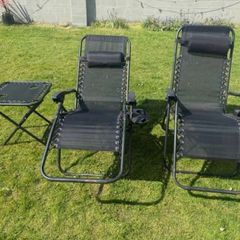 2 black recliner garden chairs