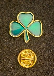 Shamrock , pin back badge.