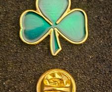 Shamrock , pin back badge.
