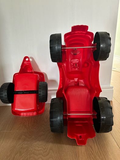 Red ride on tractor with trailer
