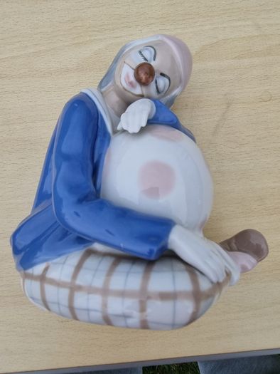 Porcelain sleeping clown with ball
