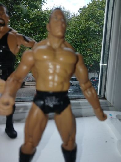 Westlers The Rock, Stone Cold and Big Show