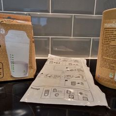 Breast pump and milk storage bags unopened and unused