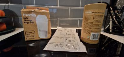 Breast pump and milk storage bags unopened and unused