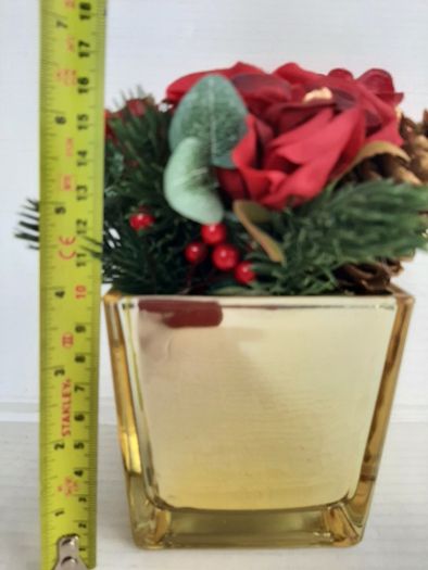 New artificial flower arrangement in vase tag attached