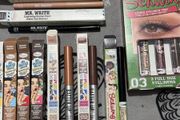 The balm tinted brow gel, clear brow gel, white, black eye pencils, liquid eyeliners